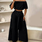 Zweiteiliges Set aus Off-Shoulder-Oberteil mit Puffärmeln und weiten Hosen – Elegant, bequem und perfekt für Sommertage ☀️